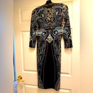 Roberto Cavalli sheath dress. Size EU 44. 3/4 sleeve. V neck. Length 40”. Black
